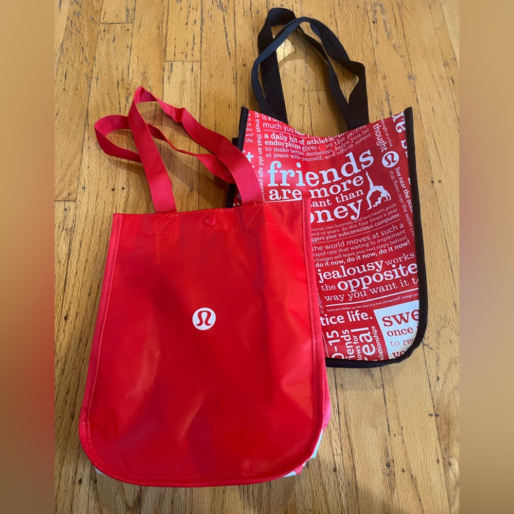 1 small black & red Classic Lululemon tote and 1 small red Lululemon tote